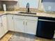 Kitchen features granite countertops, white cabinets, and black appliances at 10 Sapphire Dr, Sanford, NC 27332