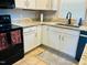 Updated kitchen with sink, countertops, and modern appliances at 10 Sapphire Dr, Sanford, NC 27332