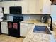 Updated kitchen with granite countertops and stainless steel appliances at 10 Sapphire Dr, Sanford, NC 27332