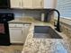 Granite countertops and sink in updated kitchen at 10 Sapphire Dr, Sanford, NC 27332