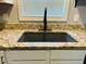 Granite countertops, black faucet, and sink with a window at 10 Sapphire Dr, Sanford, NC 27332