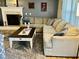 Spacious living room features a fireplace, plush sectional, and designer coffee table at 10 Sapphire Dr, Sanford, NC 27332