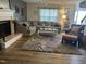 Comfortable living room featuring a fireplace, plush carpet, and a large sectional sofa at 10 Sapphire Dr, Sanford, NC 27332