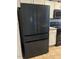 New, modern black refrigerator in updated kitchen at 10 Sapphire Dr, Sanford, NC 27332