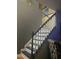 Staircase with white risers and dark treads leading to the upper level, with neutral wall paint at 10 Sapphire Dr, Sanford, NC 27332
