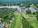 Stunning aerial view of lush golf course community by the lake, a beautiful setting at 104 Perth Ct, Cary, NC 27511