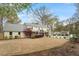 Large backyard includes covered patio, pool, and garden areas at 104 Perth Ct, Cary, NC 27511