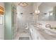 Spa-like bathroom featuring double sinks, marble countertops, and a large glass shower with dual shower heads at 104 Perth Ct, Cary, NC 27511