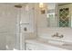 Bathroom featuring a marble countertop vanity, a sink, and a glass shower with a rainfall shower head at 104 Perth Ct, Cary, NC 27511