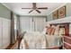 Comfortable bedroom with wood floors, ceiling fan, and closet at 104 Perth Ct, Cary, NC 27511
