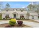 Charming two-story home with gray roof, white trim, and flower boxes under leaded glass windows at 104 Perth Ct, Cary, NC 27511