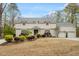 Inviting two-story home with attached two-car garage, manicured front lawn and flower boxes at 104 Perth Ct, Cary, NC 27511