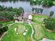 Beautiful overhead view of the golf course and club house with golf carts parked outside at 104 Perth Ct, Cary, NC 27511
