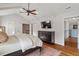 Spacious main bedroom featuring high ceilings, ceiling fan, wood floors, and a walk-in closet at 104 Perth Ct, Cary, NC 27511