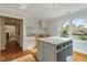 Well-lit mudroom includes modern island and sink with brass fixtures at 104 Perth Ct, Cary, NC 27511