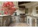 Outdoor kitchen includes grill, sink and stone countertops at 104 Perth Ct, Cary, NC 27511