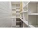 A walk-in pantry provides lots of shelving and a beverage fridge at 104 Perth Ct, Cary, NC 27511