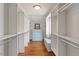 Custom walk-in closet with built-in shelving, hardwood floors, and bench seating at 104 Perth Ct, Cary, NC 27511