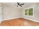 Bright bedroom with hardwood floors, ceiling fan and a sun-filled window at 1100 Medlin Dr, Cary, NC 27511