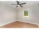 Inviting bedroom with hardwood floors and a ceiling fan at 1100 Medlin Dr, Cary, NC 27511
