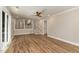 Open-concept room with stairs to the kitchen area and sliding glass doors leading outside at 1100 Medlin Dr, Cary, NC 27511