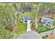 The aerial view of the home features a well-maintained lawn, spacious backyard, and a long driveway at 1165 Shonele Ln, Stem, NC 27581
