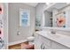 Clean bathroom featuring a white vanity, toilet, and a shower with curtain at 1165 Shonele Ln, Stem, NC 27581
