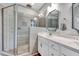 Bathroom featuring glass-enclosed shower and double sinks with modern fixtures at 1165 Shonele Ln, Stem, NC 27581