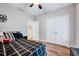 Bedroom with ceiling fan, large closet, neutral colors, and hardwood floors at 1165 Shonele Ln, Stem, NC 27581