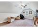 Cozy bonus room with vaulted ceilings, carpet and chairs near window at 1165 Shonele Ln, Stem, NC 27581