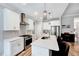 Stylish kitchen with white cabinets, stainless steel appliances, and a breakfast bar at 1165 Shonele Ln, Stem, NC 27581