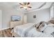 Main bedroom featuring a dresser with a TV and large bed with decorative pillows and blankets at 1165 Shonele Ln, Stem, NC 27581