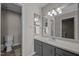 Clean bathroom featuring a modern vanity with stylish lighting and fixtures at 120 Schultz St, Chapel Hill, NC 27514
