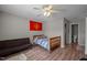 Comfortable bedroom with a ceiling fan, a bed, and an attached bathroom at 120 Schultz St, Chapel Hill, NC 27514