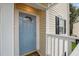 Close-up of the front door showcasing the unit number, decorative window, and exterior details at 120 Schultz St, Chapel Hill, NC 27514
