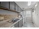 Kitchen with cabinets, sink, counter, and appliances, as well as a laundry area at 120 Schultz St, Chapel Hill, NC 27514