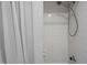 Shower with white tiled walls and a shower head at 120 Schultz St, Chapel Hill, NC 27514
