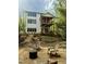 Scenic backyard with outdoor seating area, fire pit, manicured landscaping, and multi-story home at 1200 Roosevelt Dr, Chapel Hill, NC 27514