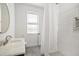 Clean bathroom with white tile, modern fixtures, and a shower with a built-in niche at 1200 Roosevelt Dr, Chapel Hill, NC 27514