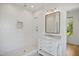 Beautiful walk-in shower with geometric tiles, brushed fixtures, and sleek vanity with marble countertop at 1200 Roosevelt Dr, Chapel Hill, NC 27514