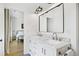 Bright bathroom features a double vanity with marble countertop and modern fixtures, offering style and functionality at 1200 Roosevelt Dr, Chapel Hill, NC 27514