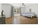 Spacious bedroom with hardwood floors, light-filled windows and stylish furnishings creates a relaxing retreat at 1200 Roosevelt Dr, Chapel Hill, NC 27514