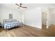 Bright bedroom with wood floors, ceiling fan and natural light offers a comfortable and inviting space at 1200 Roosevelt Dr, Chapel Hill, NC 27514