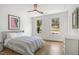 Serene bedroom with hardwood floors and abundant natural light features ample closet space and modern decor at 1200 Roosevelt Dr, Chapel Hill, NC 27514