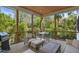 Inviting screened porch with cozy seating, perfect for outdoor dining and relaxation amidst a tranquil natural setting at 1200 Roosevelt Dr, Chapel Hill, NC 27514