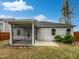 This backyard has a screened porch, and a privacy fence, perfect for relaxation at 1206 Kafka Dr, Fuquay Varina, NC 27526
