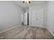 Spacious bedroom with neutral carpet, closet, and a modern ceiling fan at 1206 Kafka Dr, Fuquay Varina, NC 27526