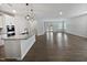 Open floor plan featuring modern finishes, granite countertops, and hardwood floors, seamlessly connecting living spaces at 1206 Kafka Dr, Fuquay Varina, NC 27526