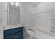 Bathroom with vanity, mirror, toilet and tub with shower features a modern and clean design at 125 Summerlin Dr, Clayton, NC 27527