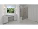 Bright bathroom featuring a glass enclosed shower with marble surround and a vanity with outdoor views at 125 Summerlin Dr, Clayton, NC 27527